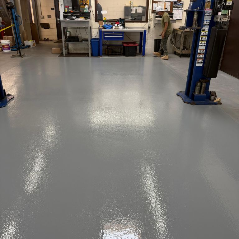Rapid curing advanced resin floor system installed on diamond ground concrete substrate for 24 7 high traffic industrial use.