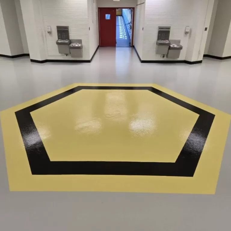Commercial hallway with decorative epoxy floor coating and geometric design