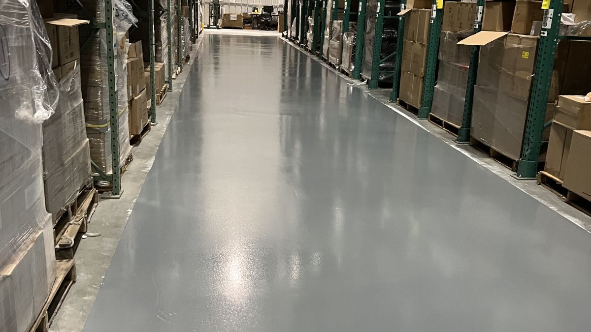 High build industrial warehouse epoxy flooring handling heavy forklift traffic in a Bensalem PA logistics hub.