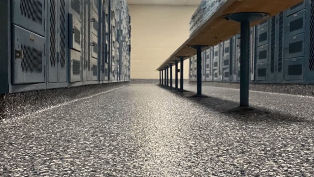 Industrial epoxy locker room flooring with high-durability finish and non-porous moisture barrier