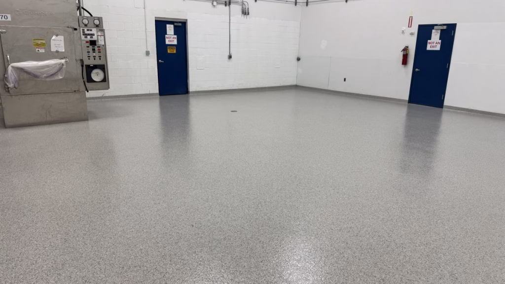 Completed quartz resinous epoxy floor with high-gloss aliphatic urethane topcoat installed by an epoxy flooring contractor in Morristown NJ.